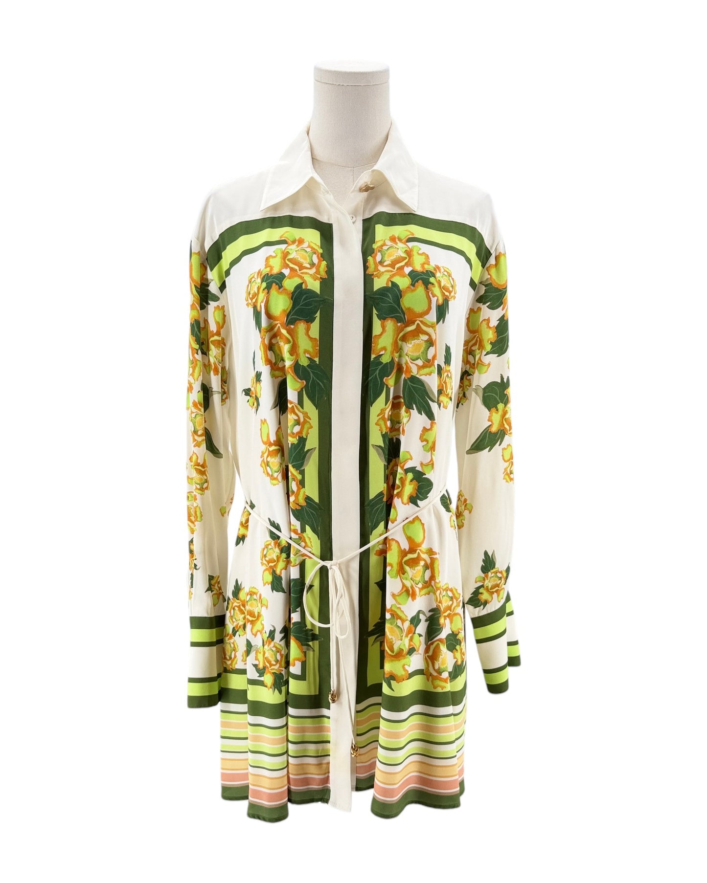 Colorful floral-patterned shirt on a mannequin against a white background