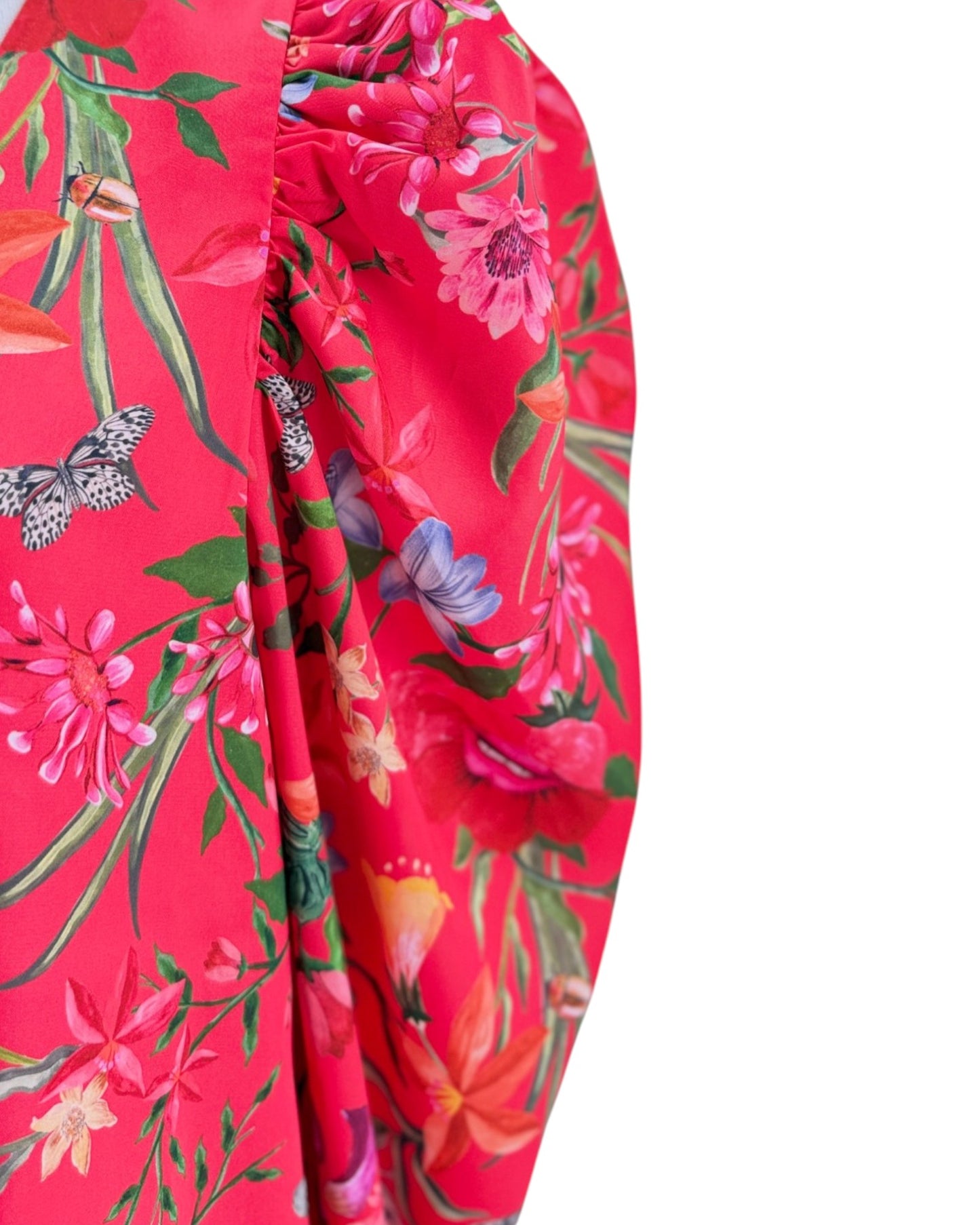 Red floral dress with colorful flowers and butterflies on a white background