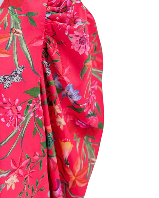 Red floral dress with colorful flowers and butterflies on a white background