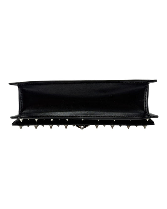Black handbag with spike details and chain strap on a white background