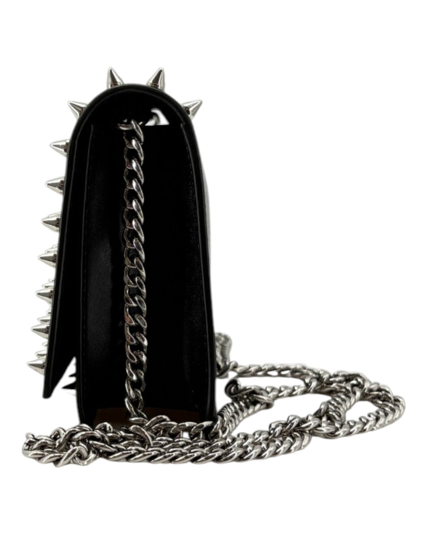 Black handbag with silver spikes and chain strap on a white background