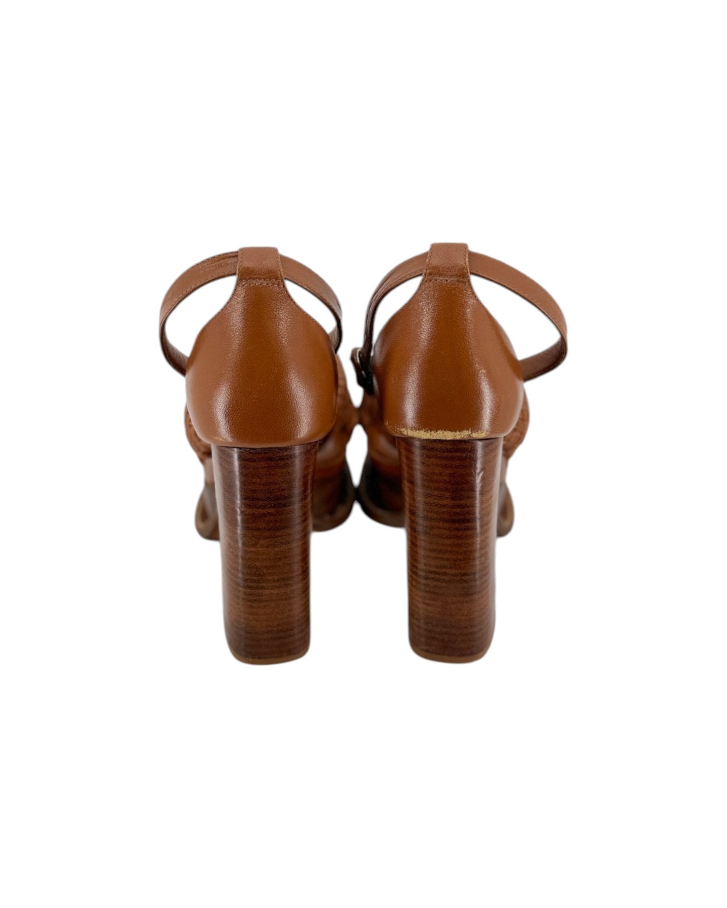 A pair of women's block-heel sandals in a warm cognac brown leather, shown from the back on a plain white background.