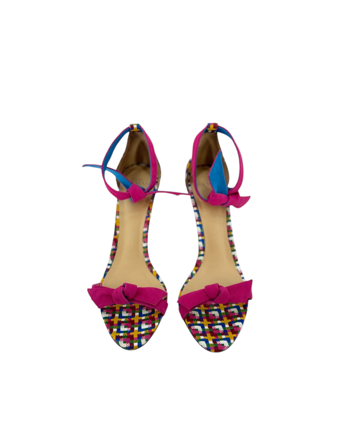 High heels with a multi color geometric print with a pink ankle and toe strap on white background