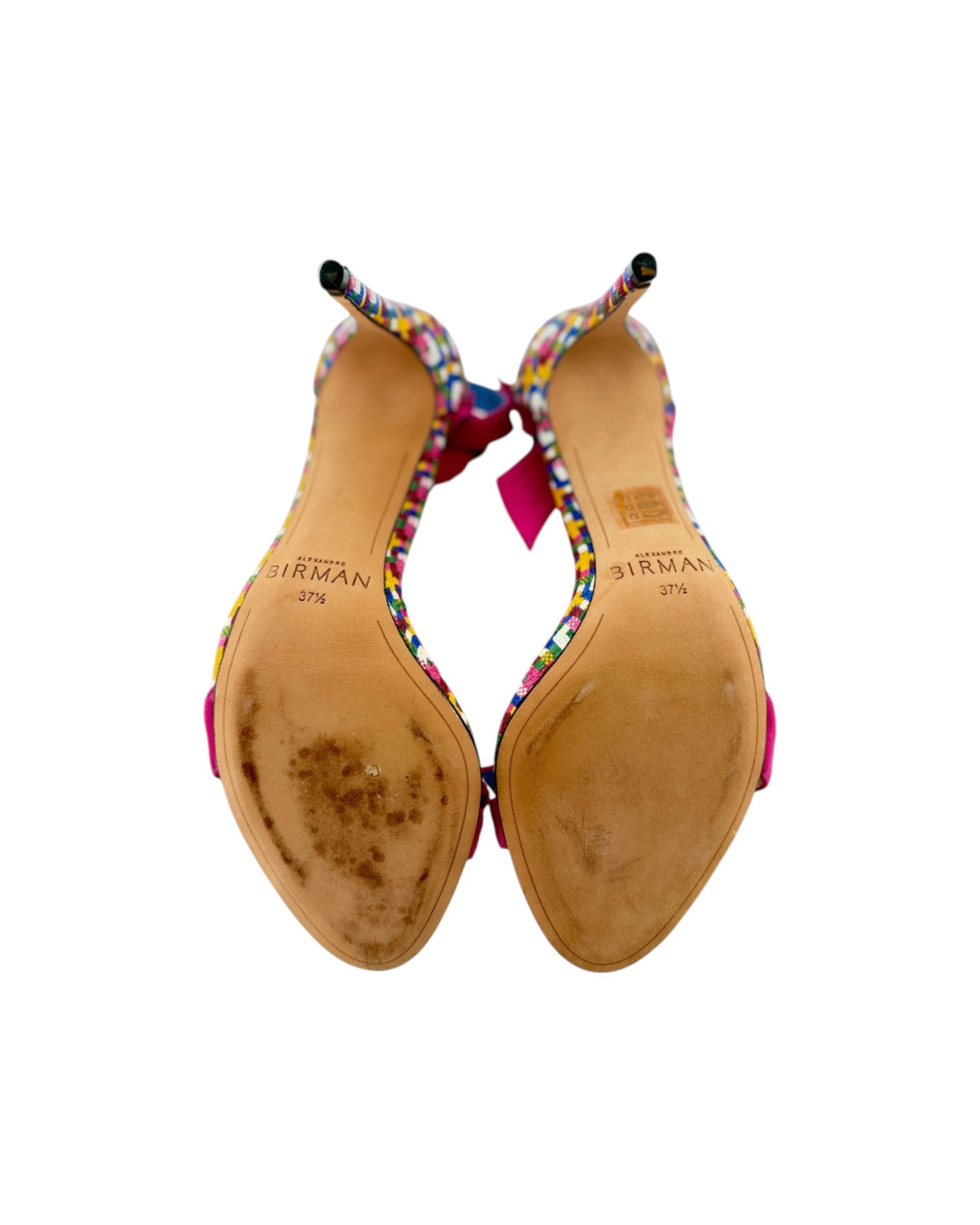 High heels with a leather sole that say BIRMAN on a white background