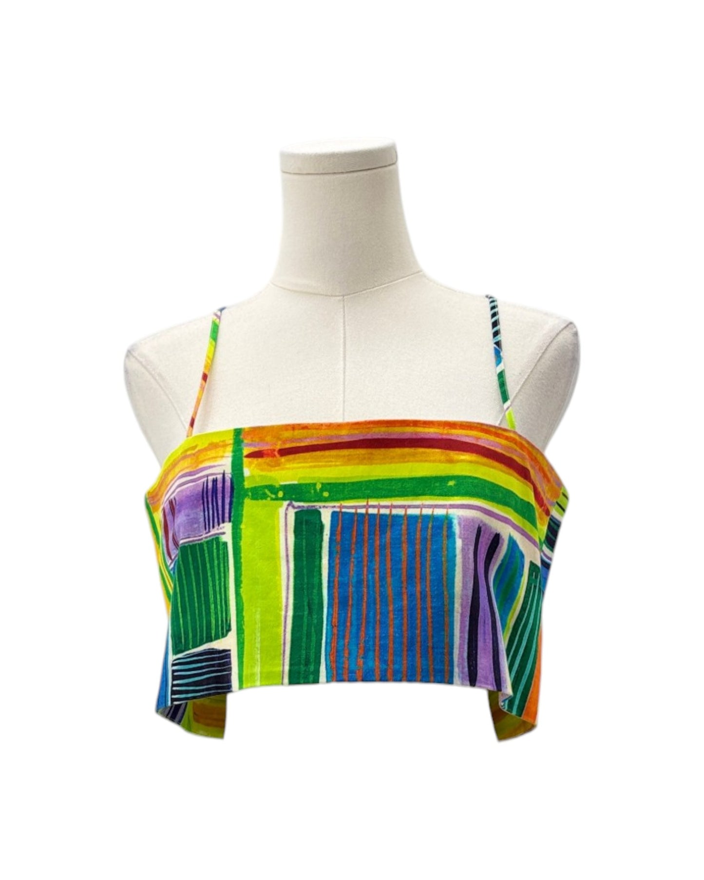 Colorful striped crop top on a mannequin against a white background