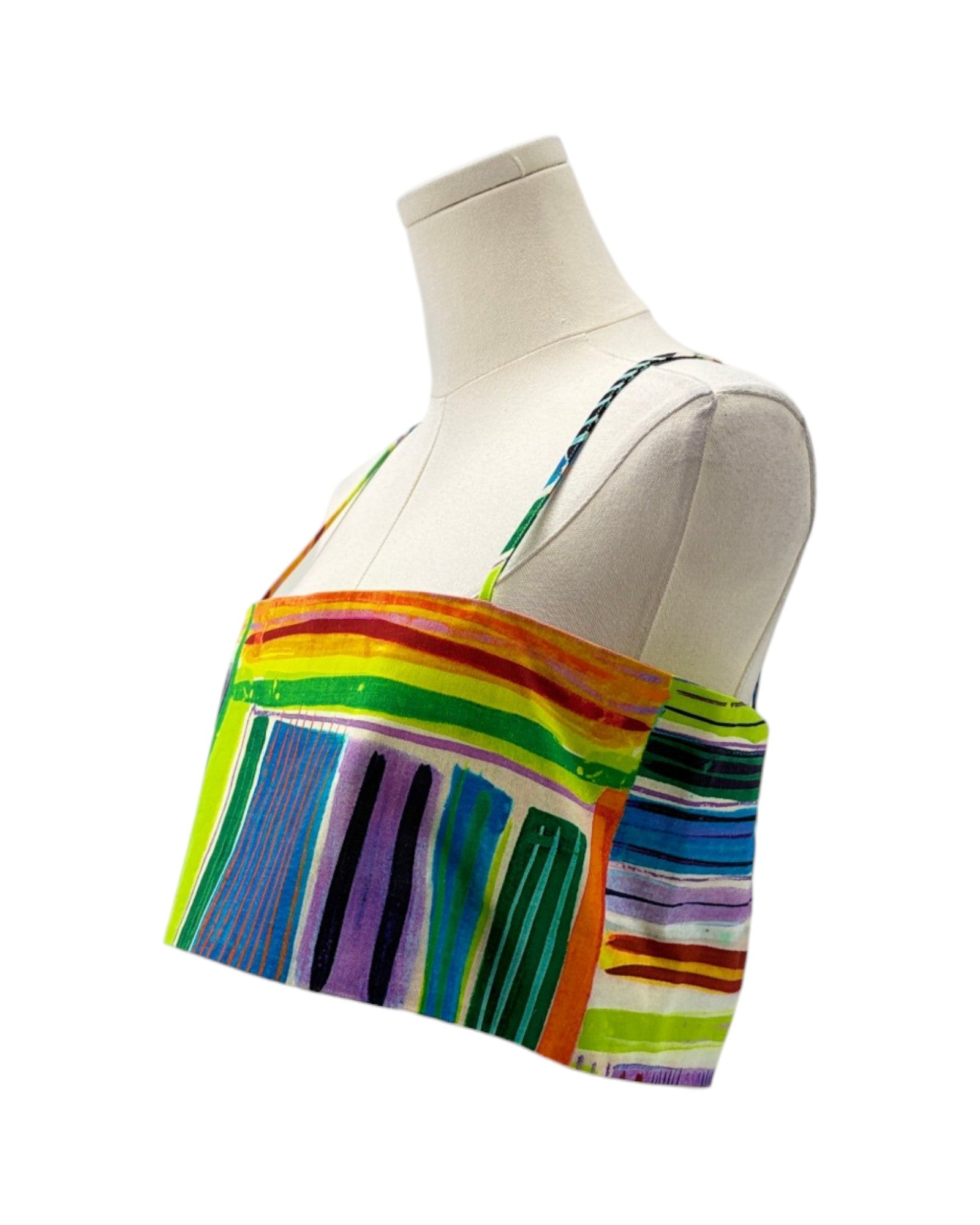 Colorful striped top on a mannequin against a white background