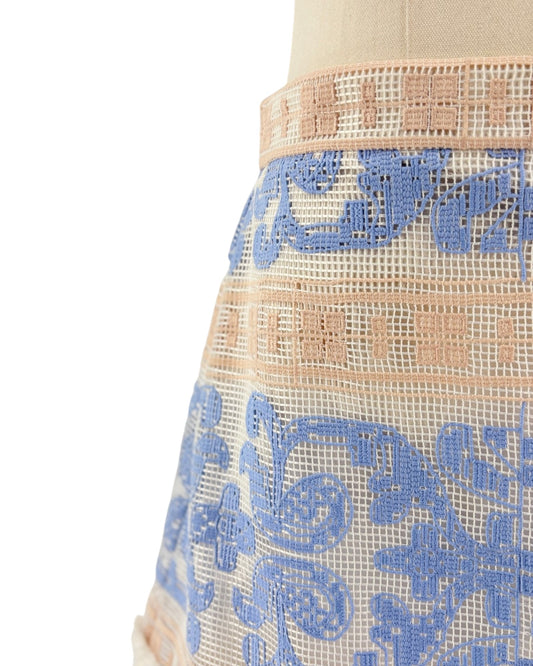 Lace skirt with blue floral patterns on a white background