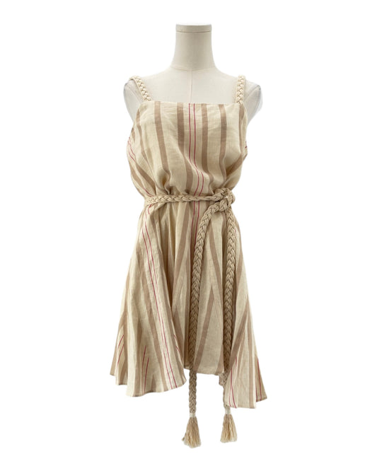 Striped dress with tassels on a mannequin against a white background