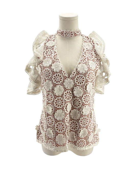 Lace v neck short sleeve blouse on a mannequin on a white background