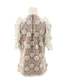 Lace v neck short sleeve blouse on a mannequin on a white background