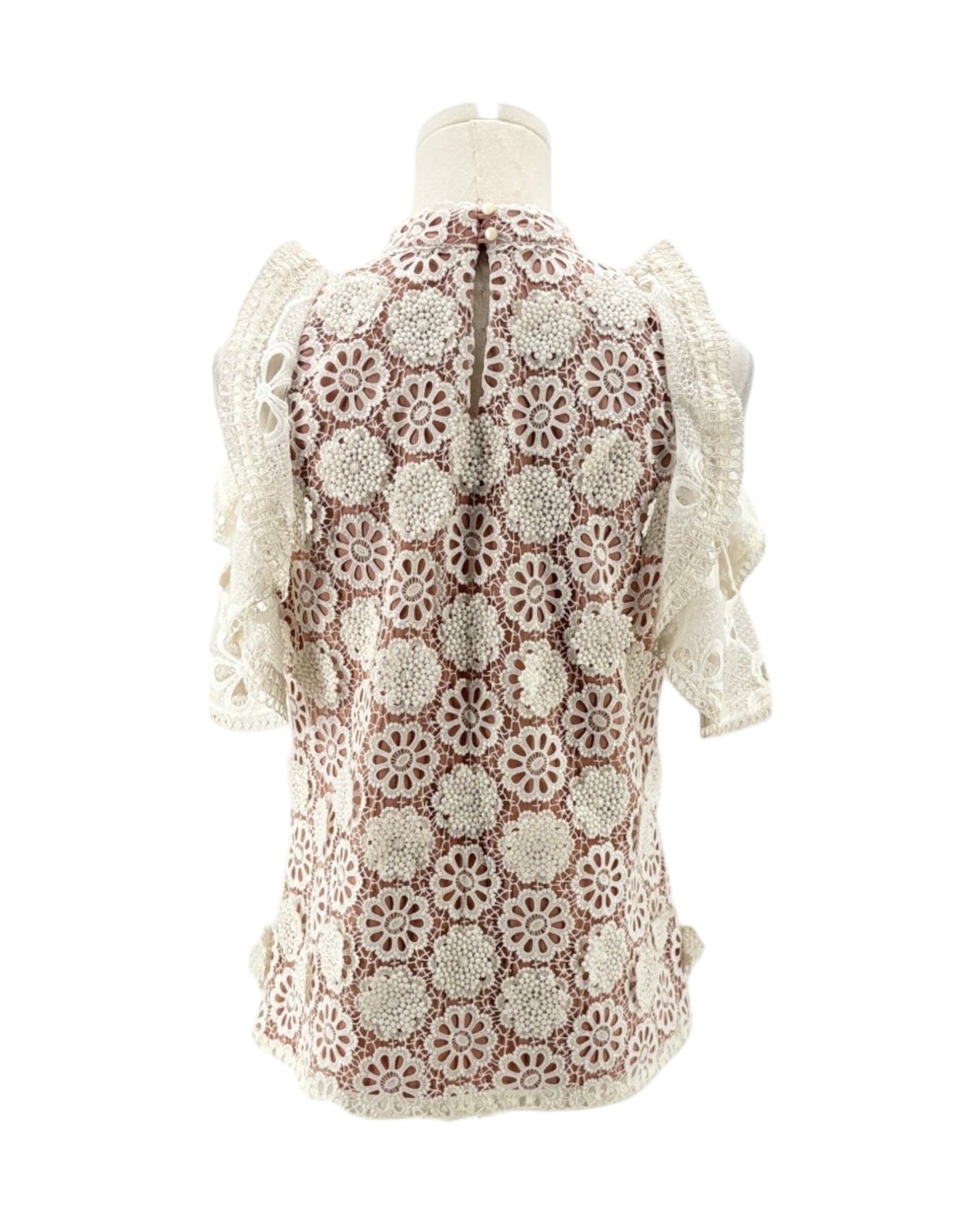 Lace v neck short sleeve blouse on a mannequin on a white background