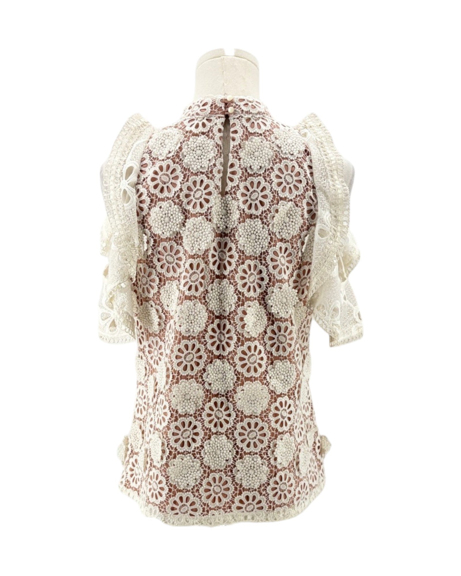 Lace v neck short sleeve blouse on a mannequin on a white background