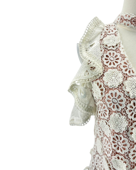 Lace v neck short sleeve blouse on a mannequin on a white background