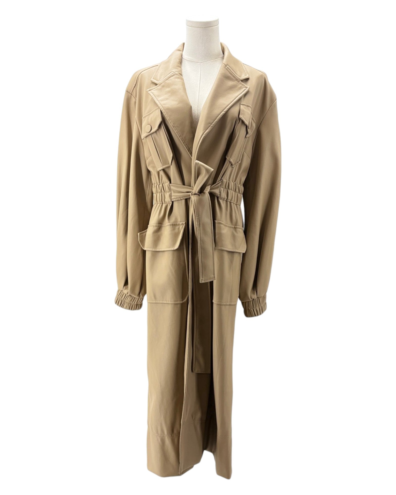 Beige trench coat and pants on a mannequin against a white background