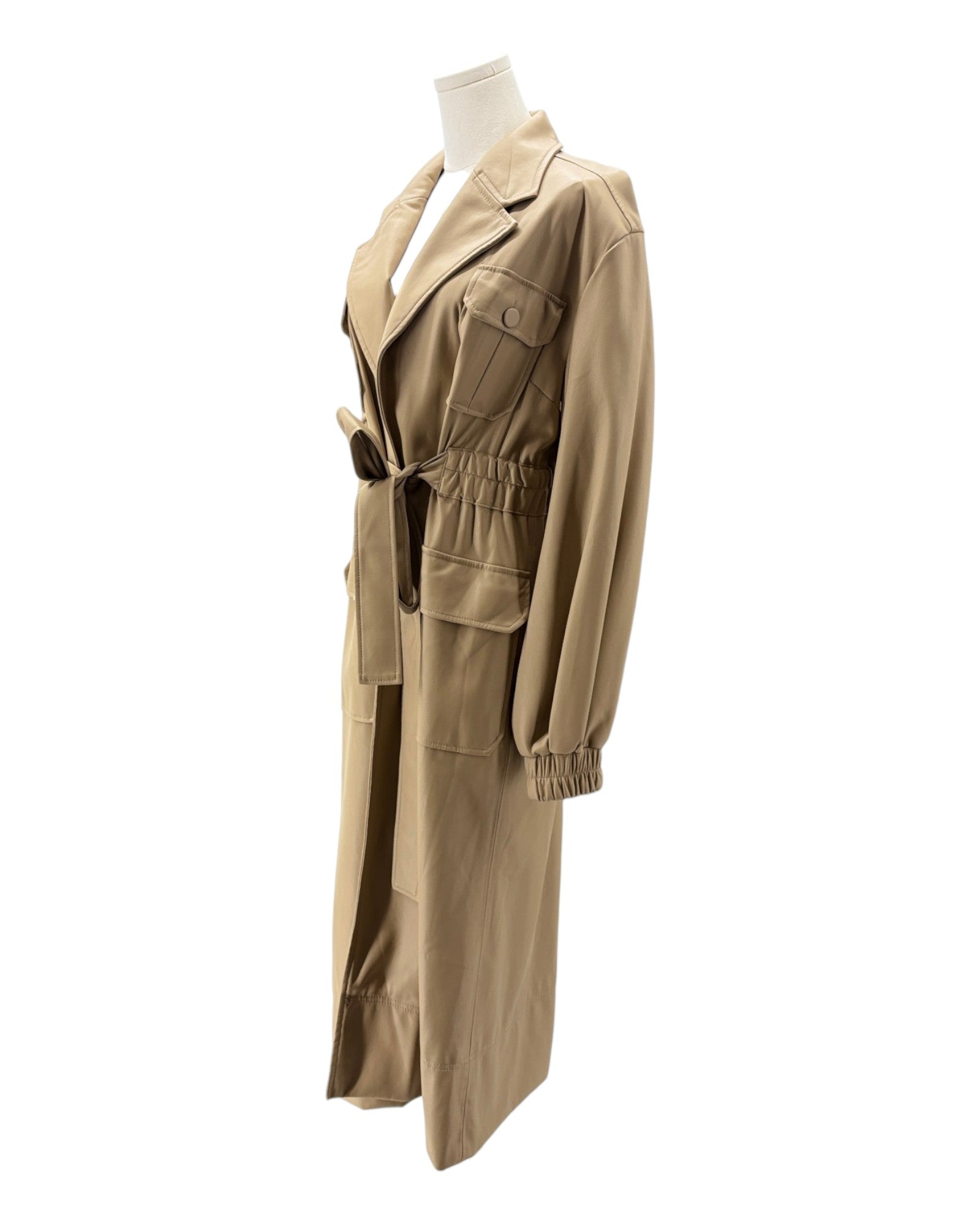 Beige trench coat on a mannequin against a white background