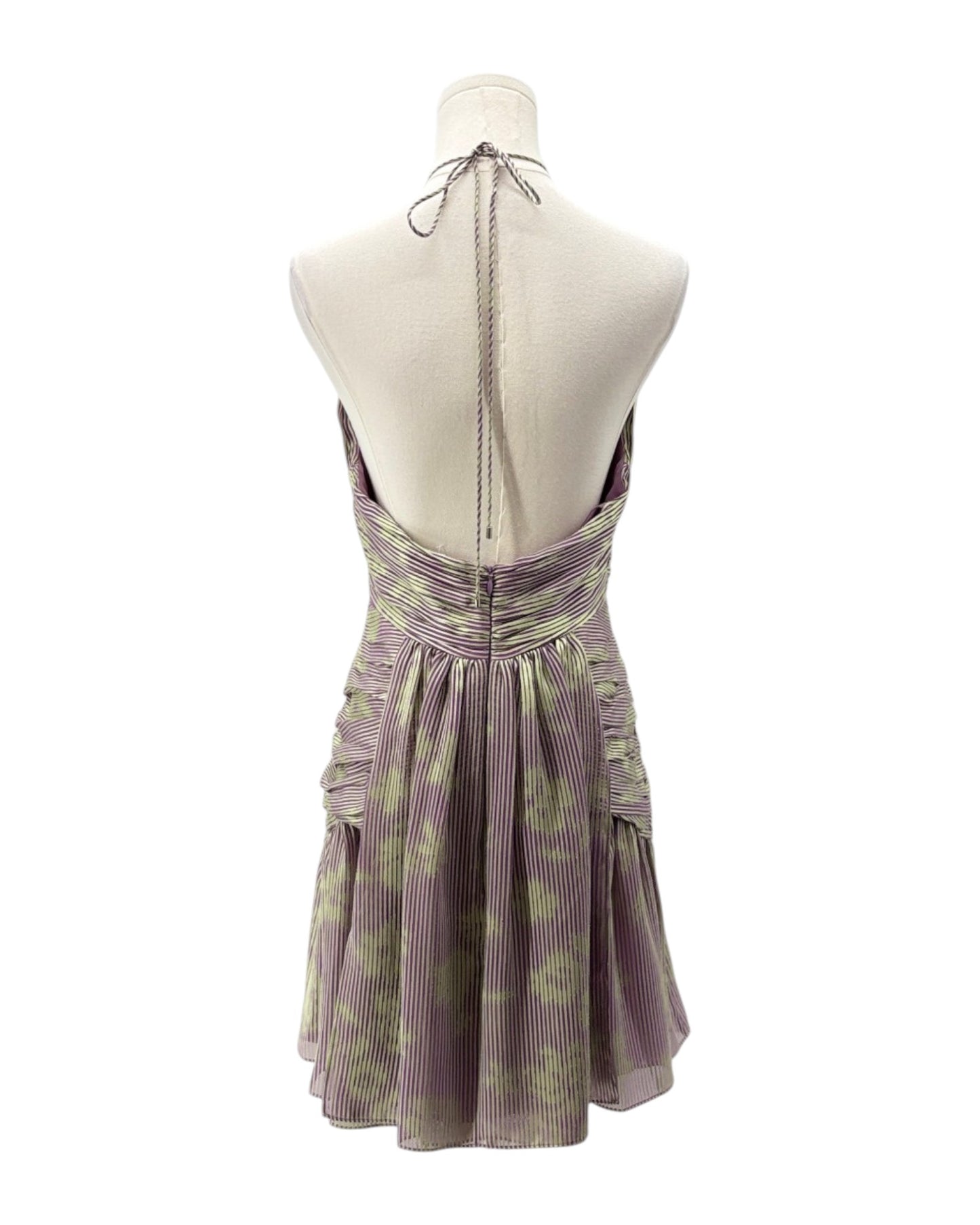 Purple floral dress on a mannequin against a white background