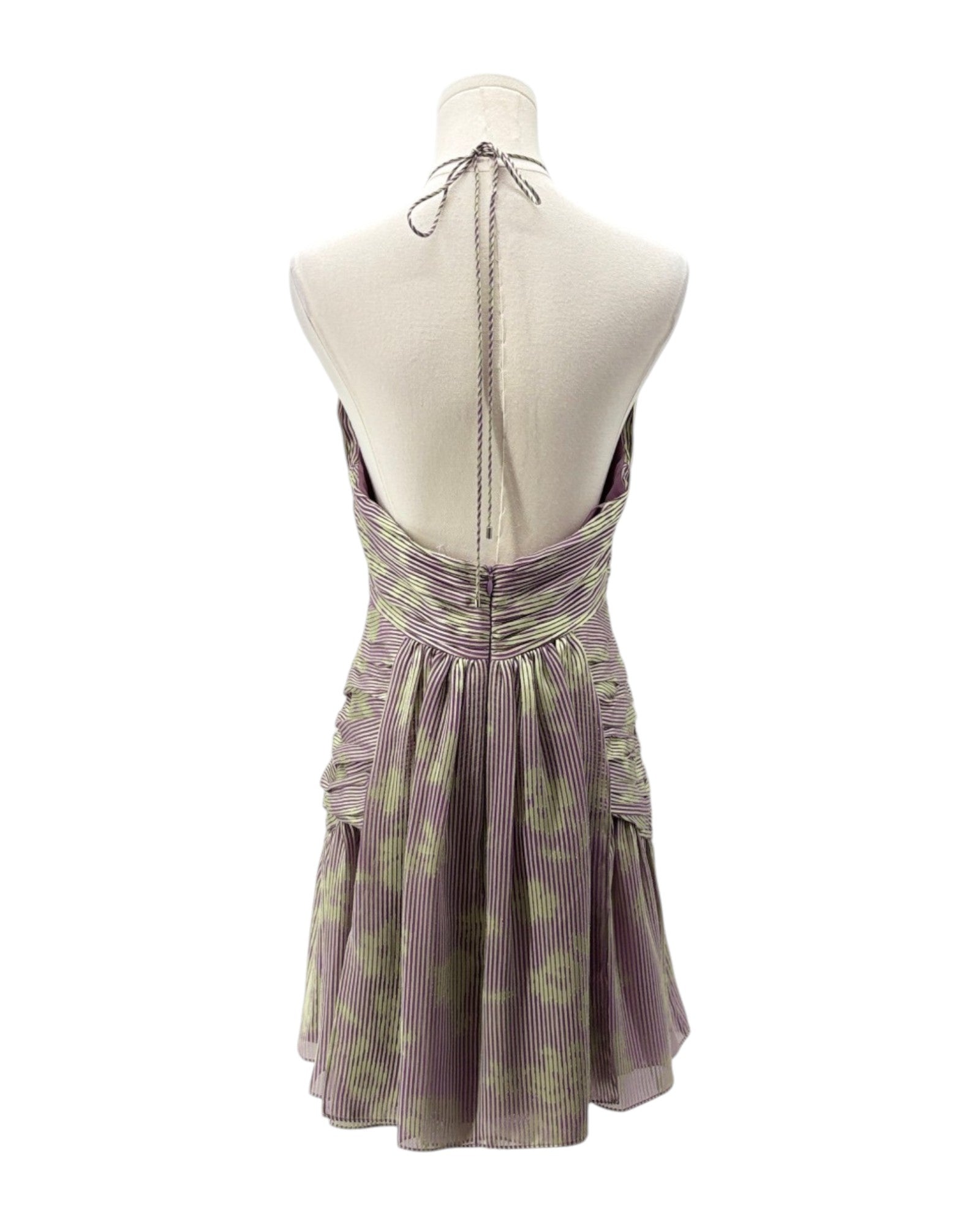 Purple floral dress on a mannequin against a white background