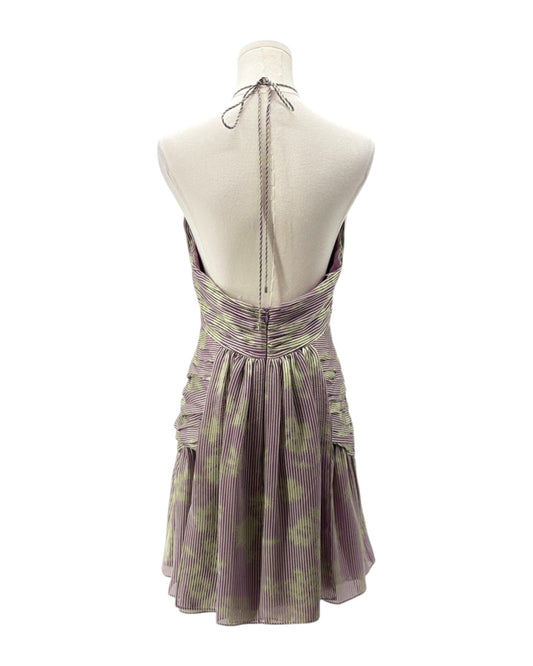 Purple floral dress on a mannequin against a white background