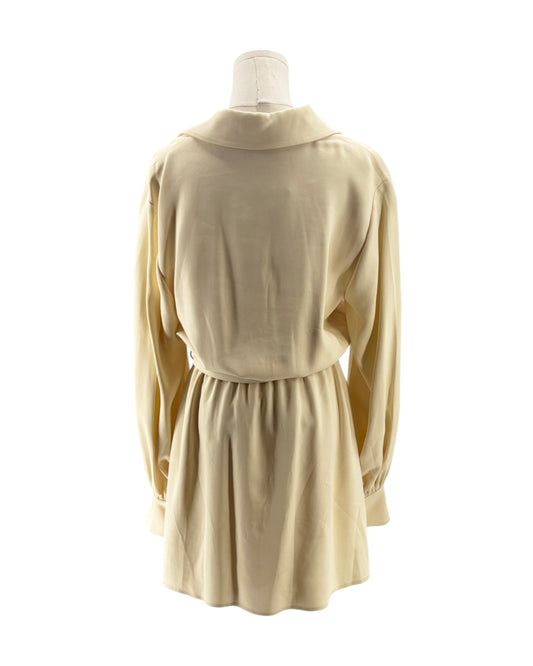 Beige dress on a mannequin against a white background