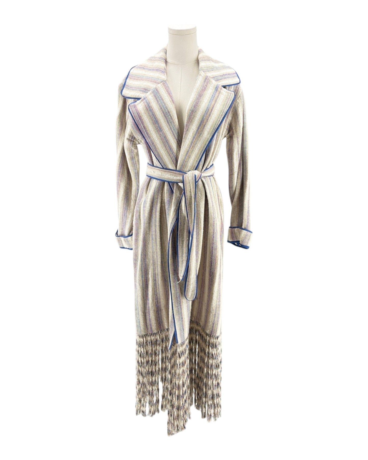 Striped coat with fringes on a mannequin against a white background
