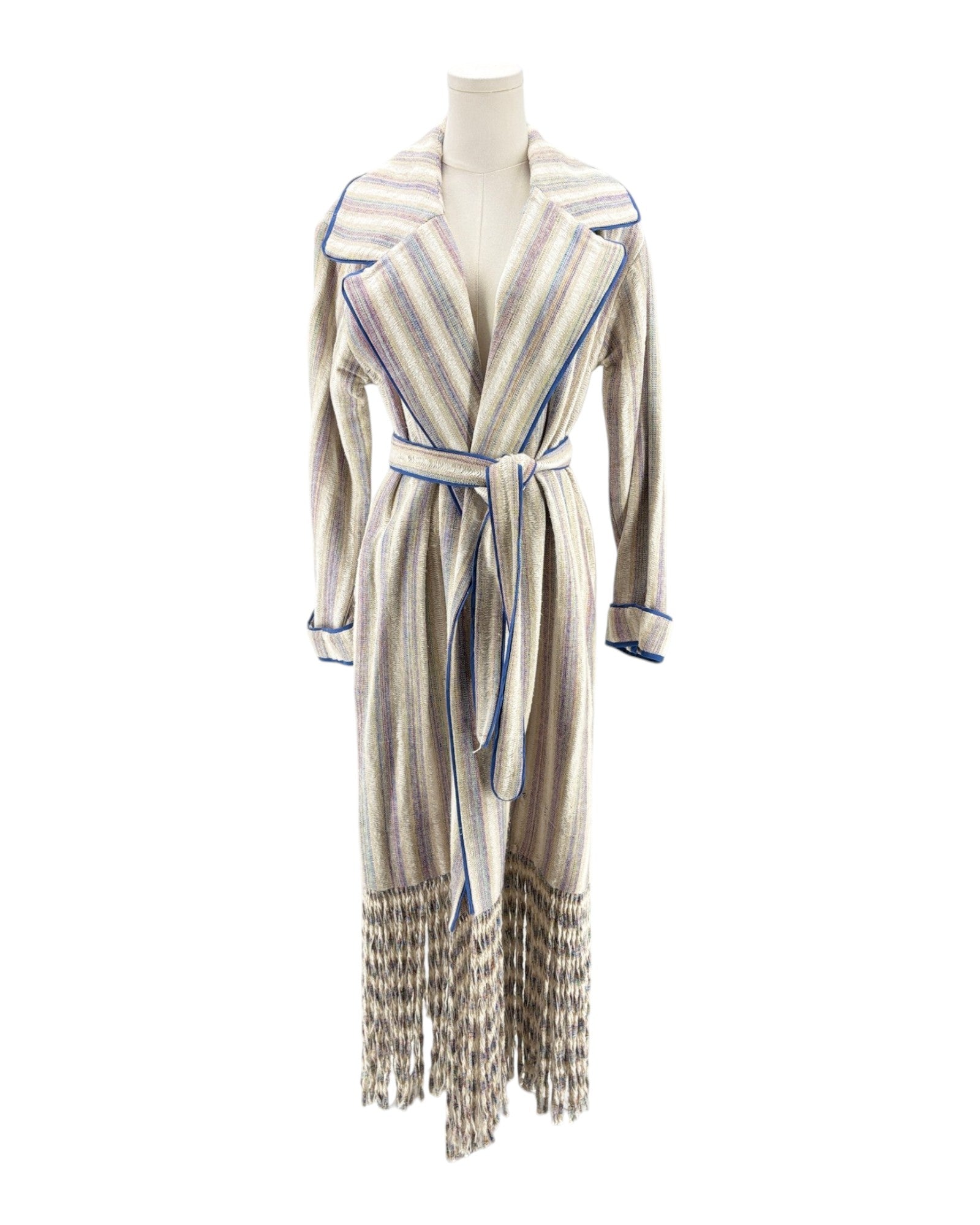 Striped coat with fringes on a mannequin against a white background