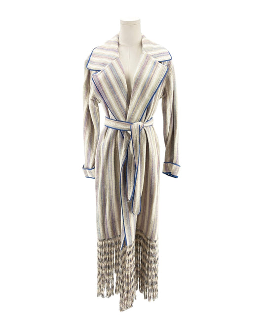 Striped coat with fringes on a mannequin against a white background