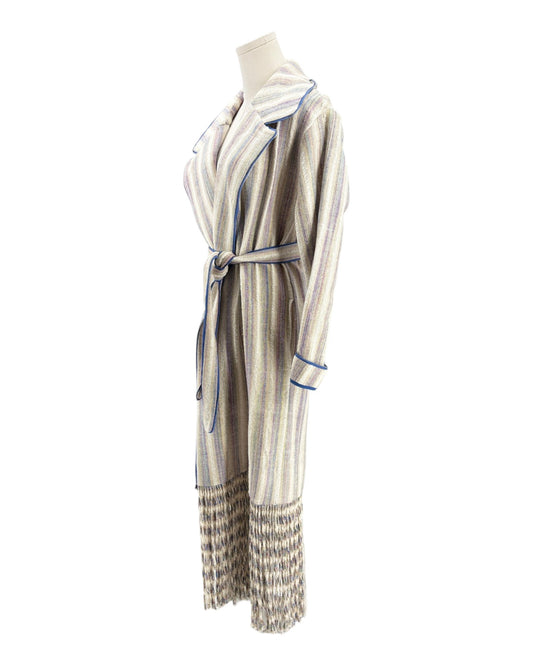 Striped coat on a mannequin against a white background