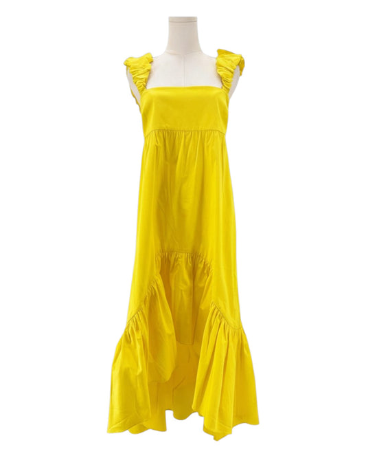 Alexis yellow dress with ruffled shoulders on a mannequin against a white background