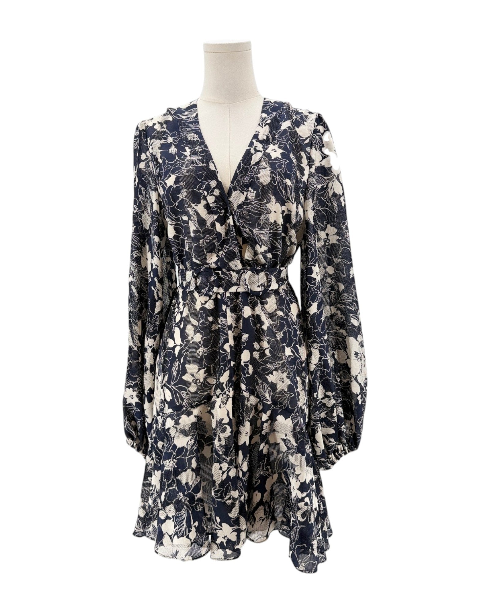 Floral dress on a mannequin against a white background