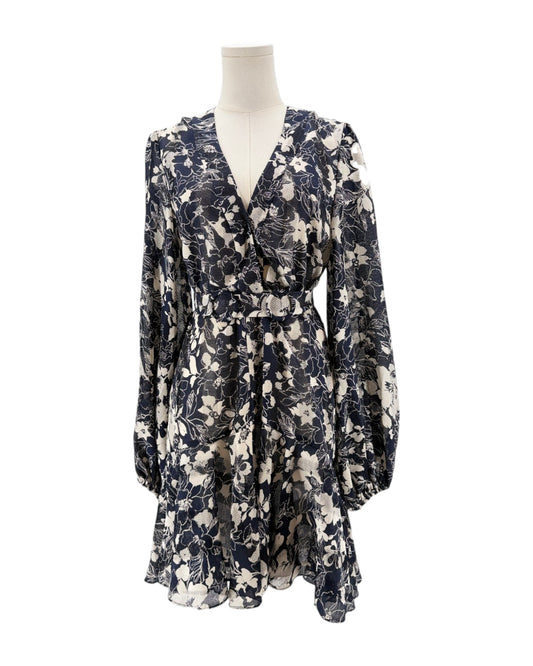 Floral dress on a mannequin against a white background