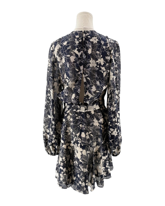 Floral patterned dress on a mannequin against a white background