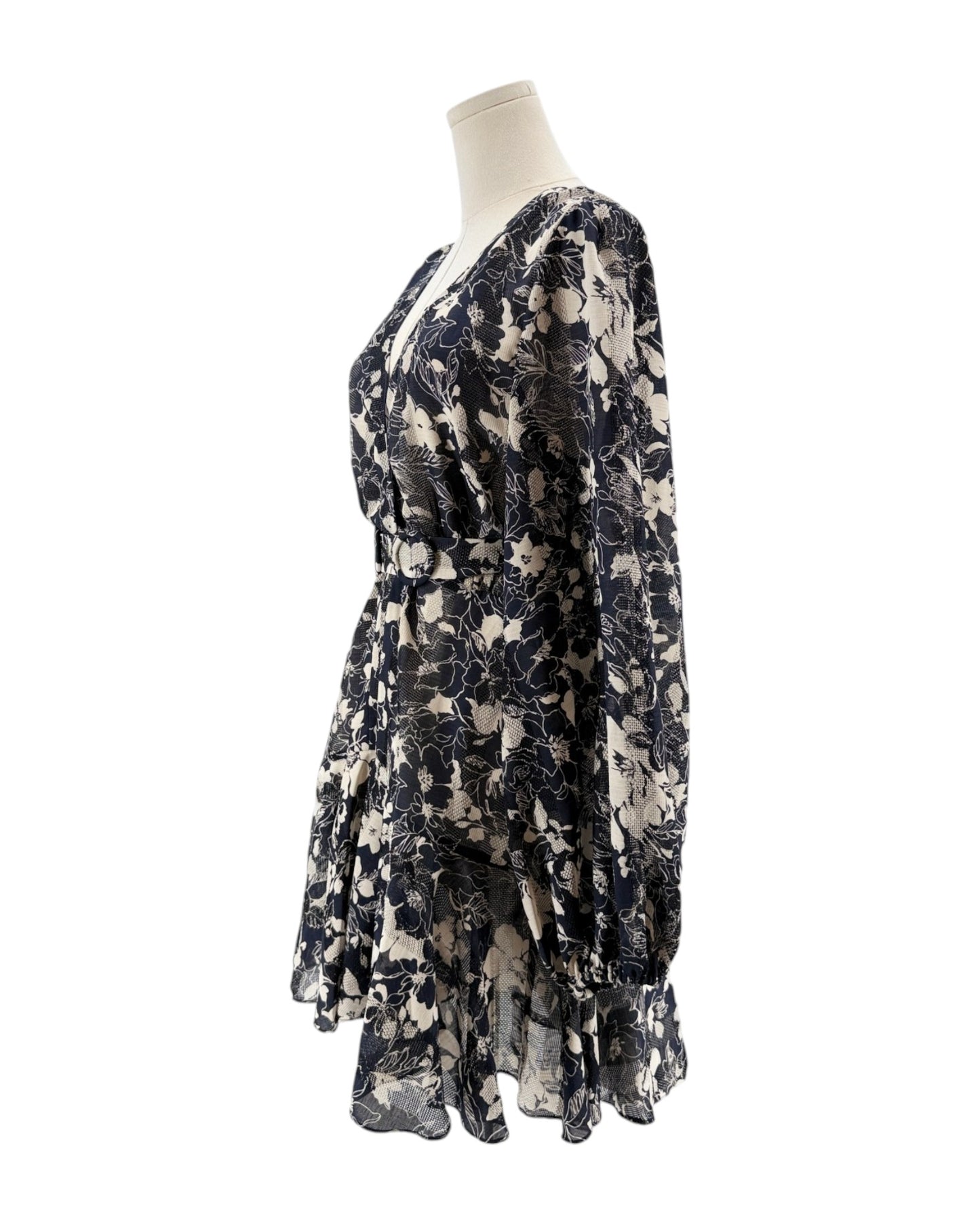 Floral patterned dress on a mannequin against a white background