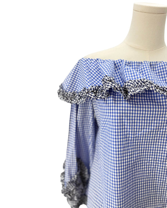 Alexis blue checkered gingham off-shoulder top with decorative sleeves on a mannequin against a white background