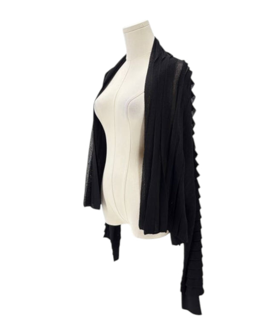 Black cardigan on a mannequin against a white background