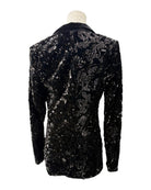 Black sequined jacket on a mannequin against a white background