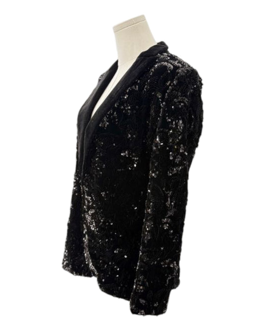 Black sequin jacket on a mannequin against a white background