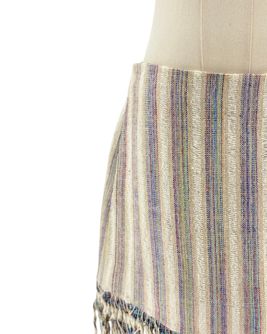 Striped fabric on a mannequin with a white background