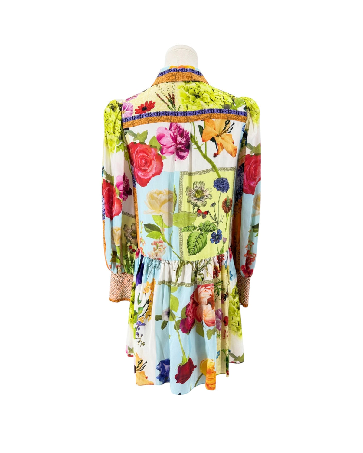 Floral long sleeve multi color mini dress on a white background on a mannequin
