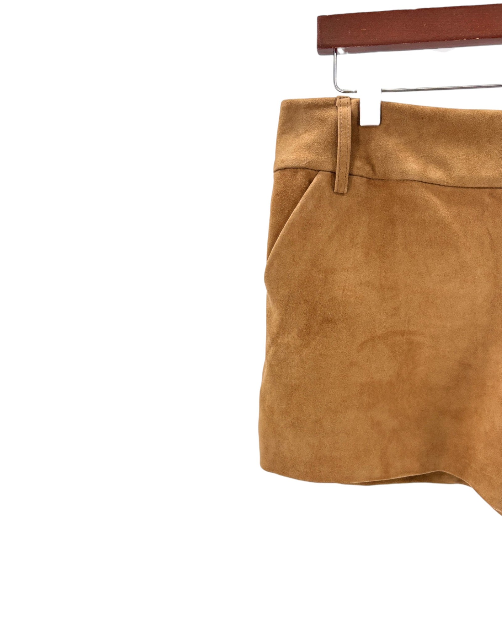 Brown suede skirt on a hanger against a white background