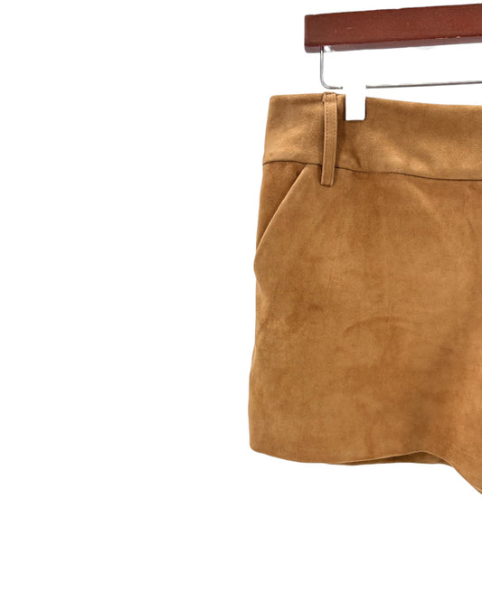 Brown suede skirt on a hanger against a white background