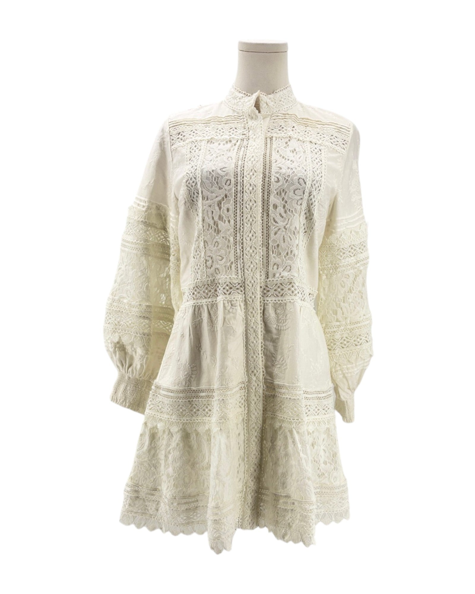 White lace dress on a mannequin against a white background
