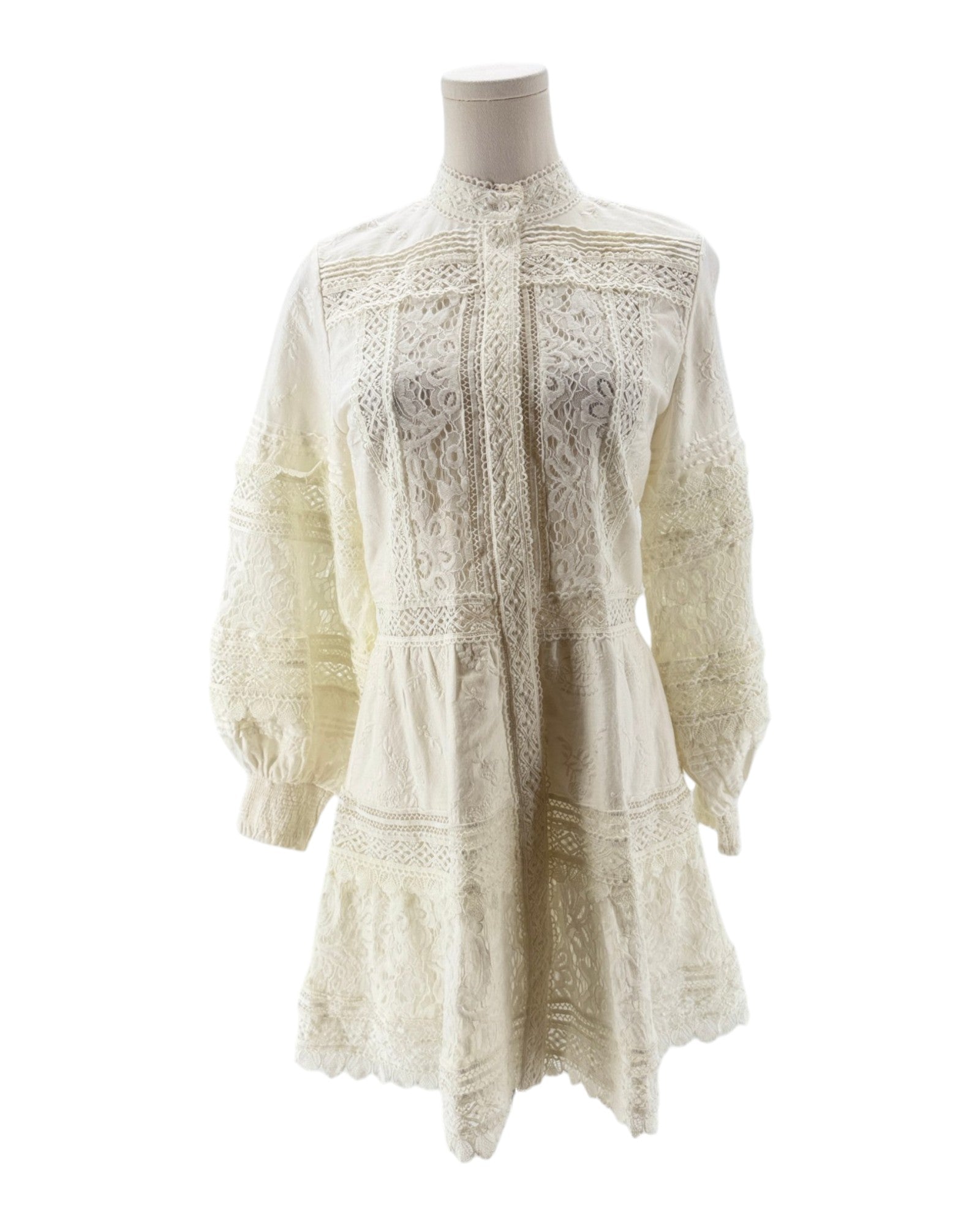 White lace dress on a mannequin against a white background