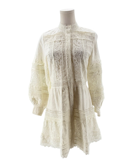 White lace dress on a mannequin against a white background