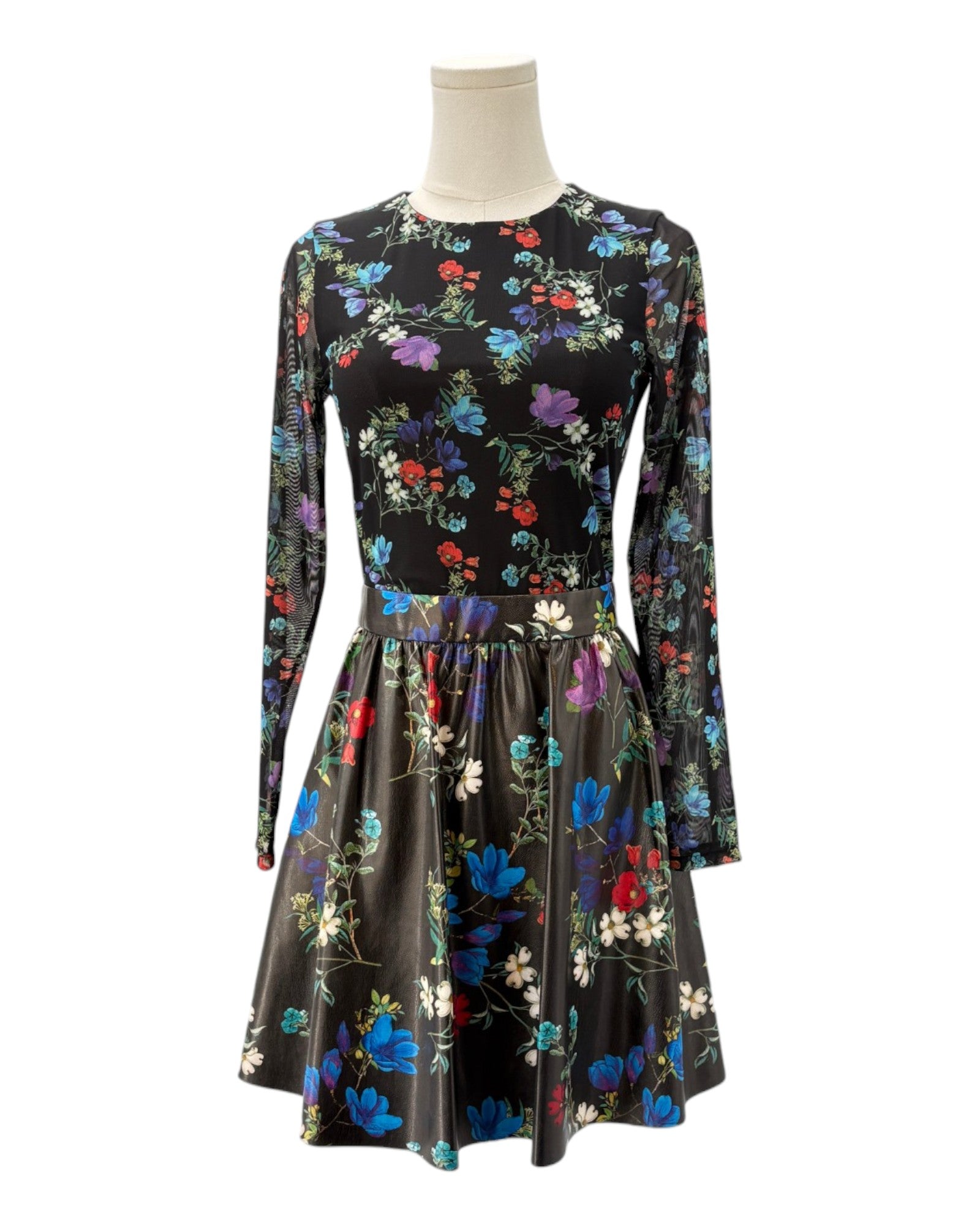 Floral dress on a mannequin against a white background