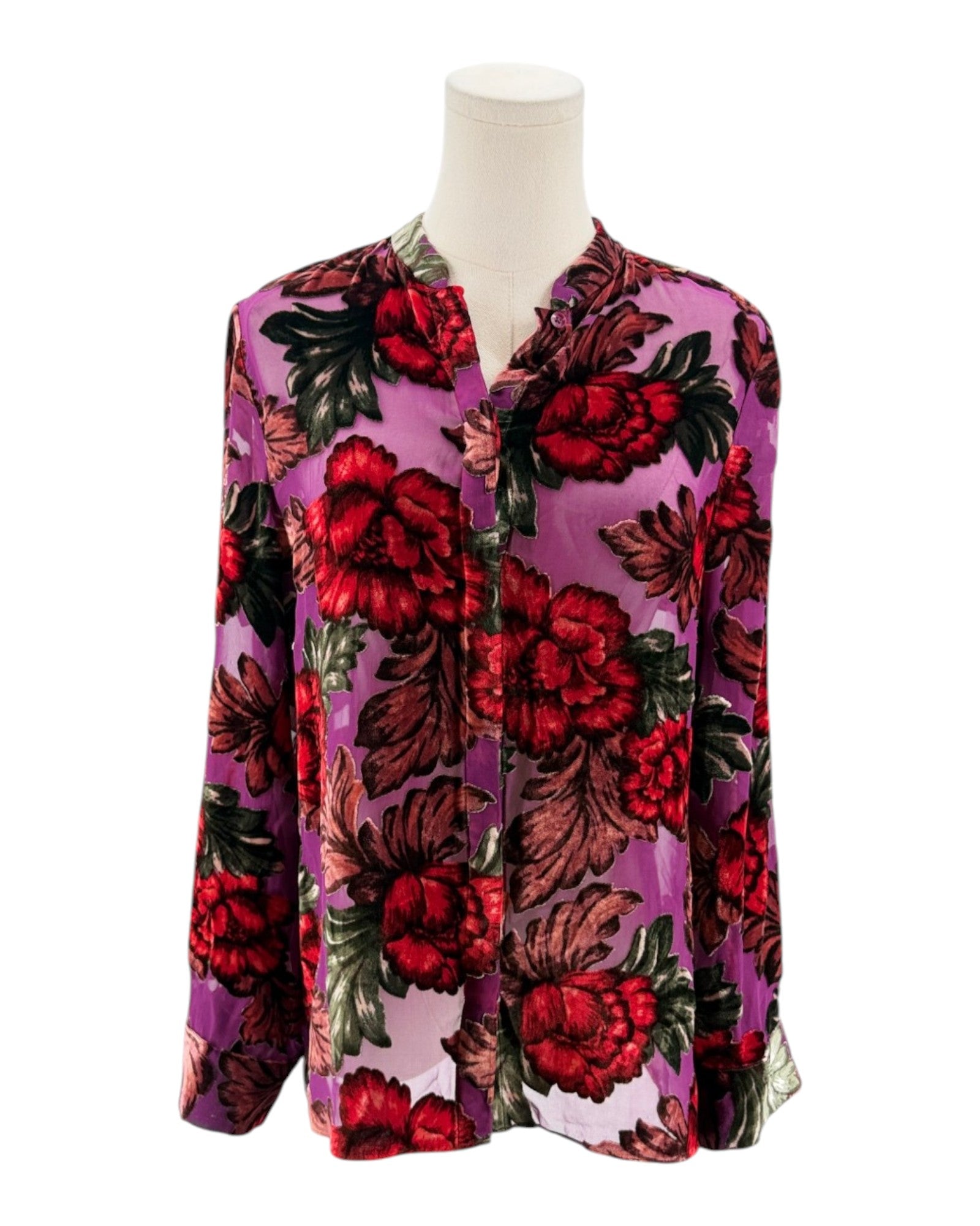 Floral patterned shirt on a mannequin against a white background