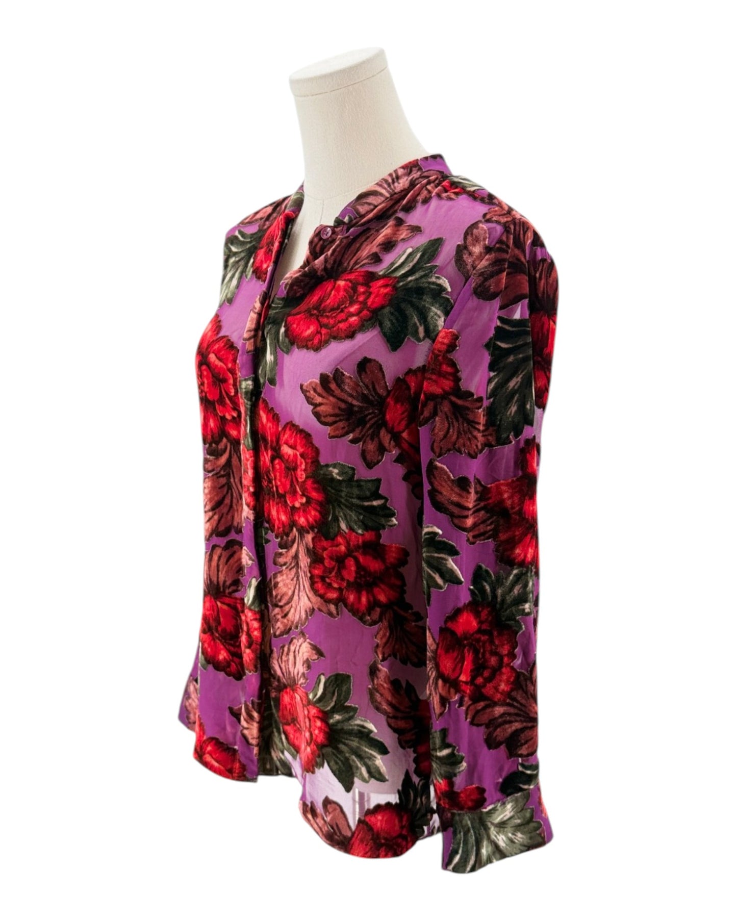 Floral patterned shirt on a mannequin against a white background