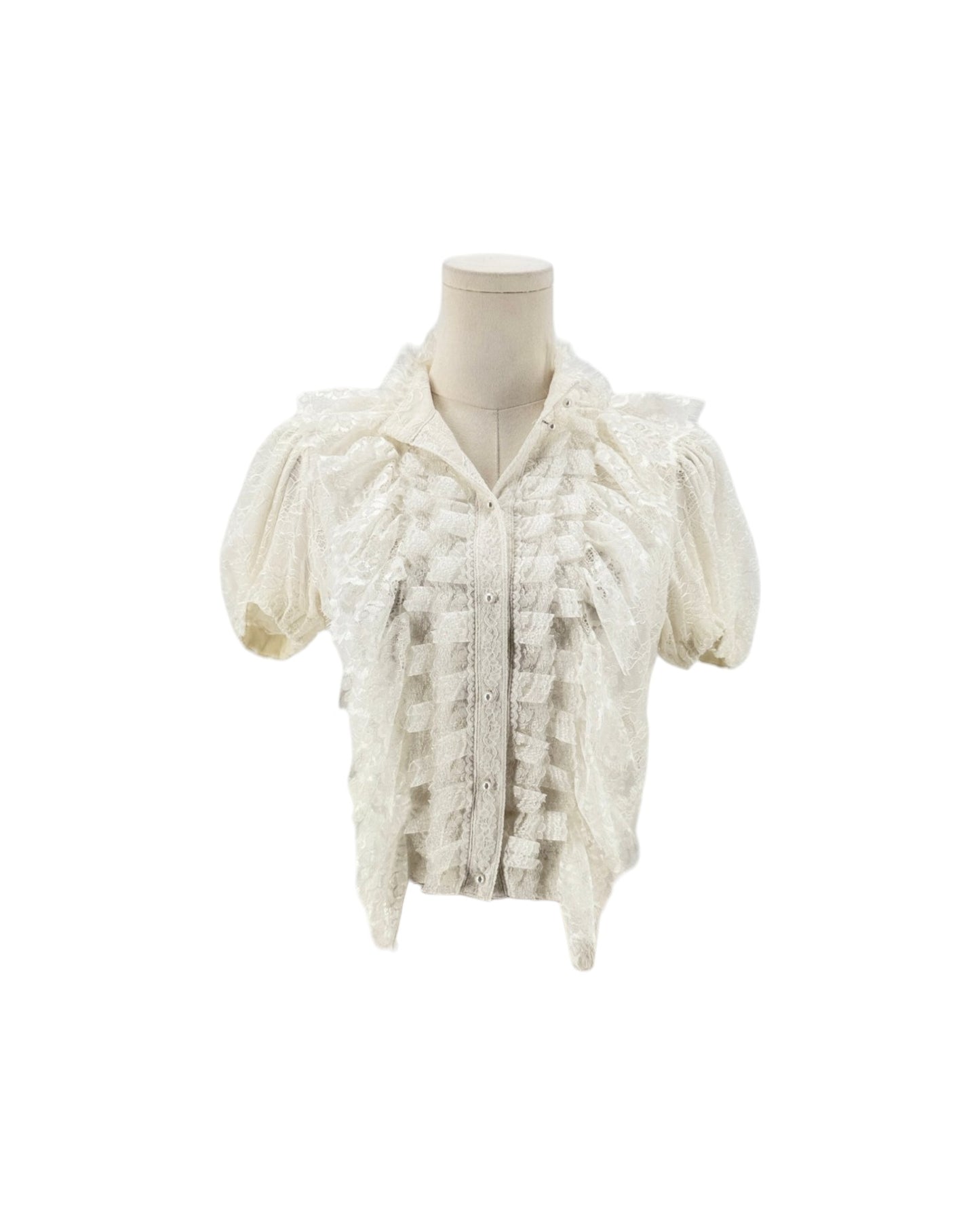 An off-white lace short-sleeve blouse with textured ruffles and a high collar, displayed on a cream mannequin torso against a plain white background.