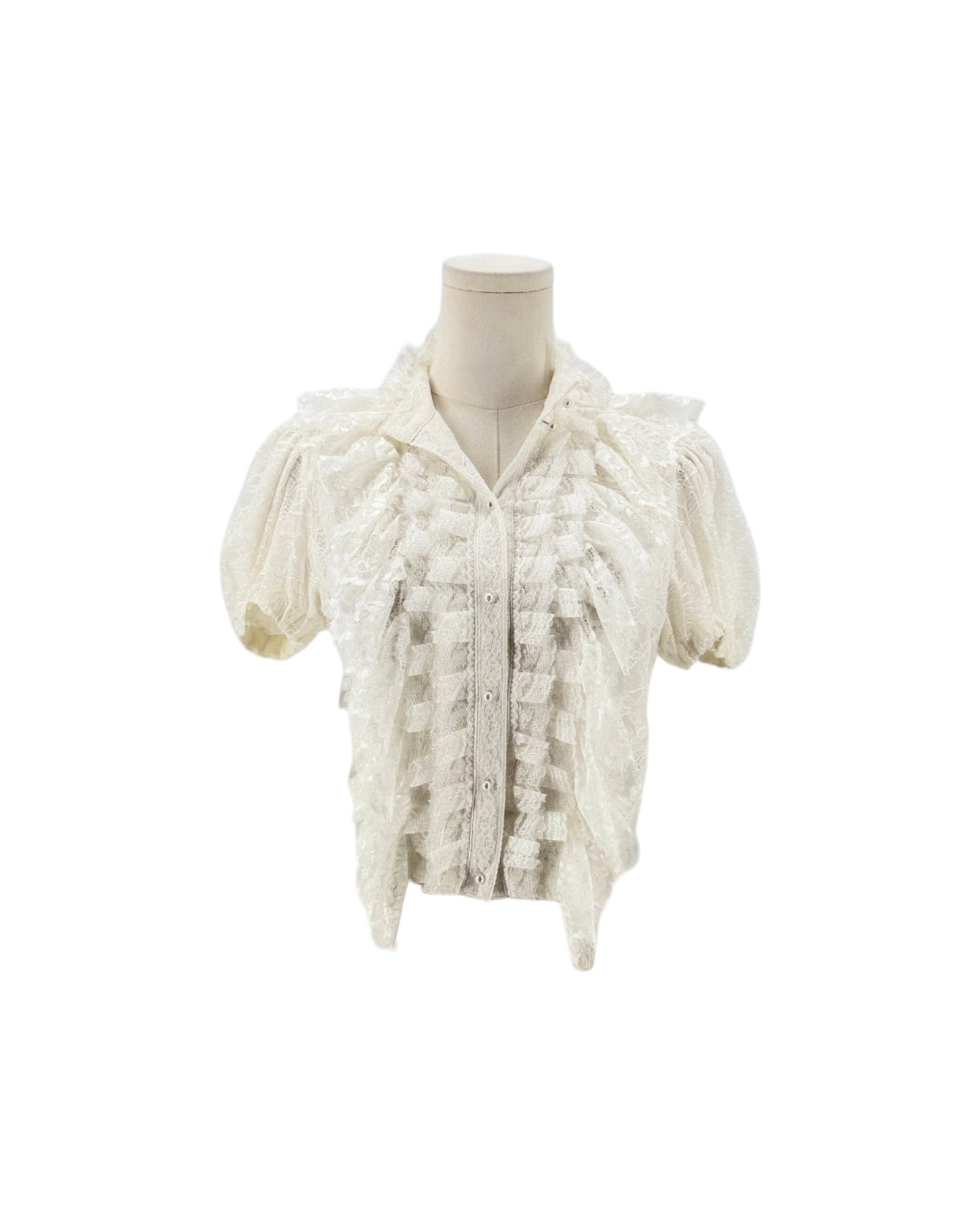 An off-white lace short-sleeve blouse with textured ruffles and a high collar, displayed on a cream mannequin torso against a plain white background.