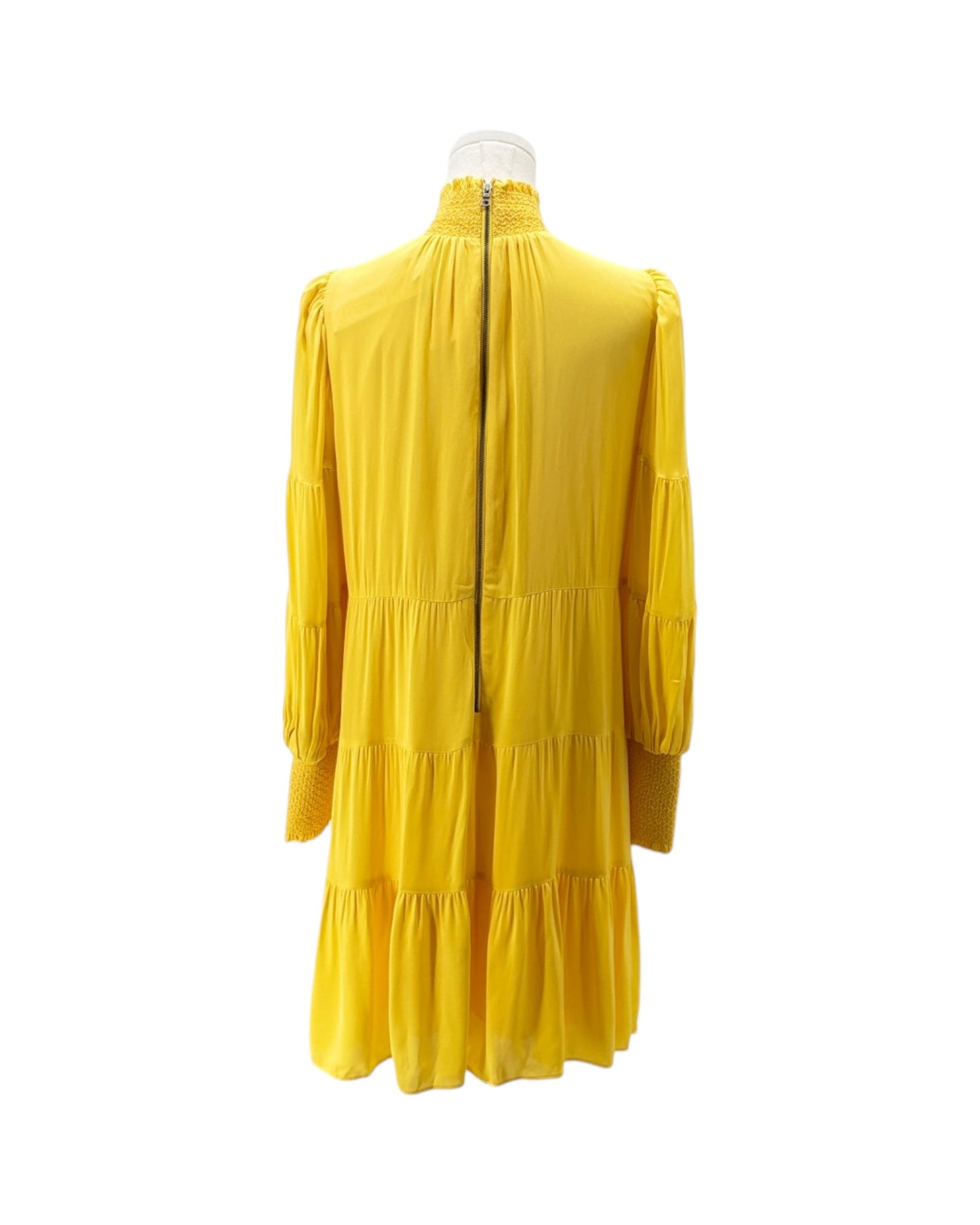 Yellow dress on a mannequin against a white background