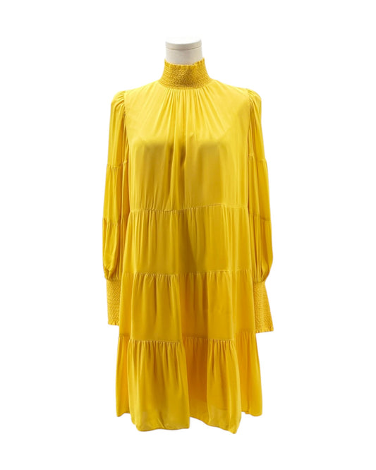 Yellow dress on a mannequin against a white background